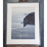 Naomi Tydeman, RI (contemporary Welsh), misty beach scene with rocky cliff and distant island,