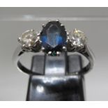 Three stone diamond and sapphire ring. Ring size N. Approx weight 2.5 grams. (B.P. 21% + VAT)