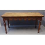 19th Century oak side or kitchen table, the three plank top above ornately carved frieze to all