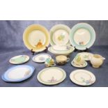 A large collection of Clarice Cliff pottery items to include: lidded tureen, various plates with
