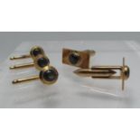 A cased set of 14ct gold cufflinks with three matching studs. Stamped, 'Alex' and 14K. In Alex &