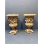 Pair of 19th century style composition Campana shaped planters, overall decorated with relief
