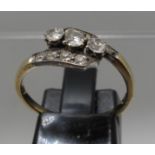 Diamond three stone ring set on a twist with diamond shoulders. Ring size O&1/2. Approx weight 2.