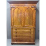 19th Century flame mahogany two stage press cupboard, the moulded cornice above two blind panelled