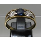 18ct gold three stone diamond and sapphire ring. Ring size M. Approx weight 4.1 grams. (B.P. 21% +