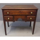 Early 19th Century Welsh oak lowboy, the moulded top above an arrangement of three drawers, with