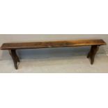 Rustic elm bench of rectangular form with shaped sides. 177 x 17 x 45cm approx. (B.P. 21% + VAT)