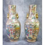 A pair of 19th Century Chinese porcelain Canton famille rose figural floor vases with panels of
