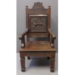 Early 20th Century Welsh oak Eisteddfod chair, the moulded back with raised, carved and text '