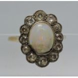 18ct gold large opal and diamond ring. Ring size T. Approx weight 5.4 grams. (B.P. 21% + VAT) opal