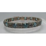 An Art Deco blue and white zircon bracelet set in silver 17.25 inches (18.5cm). Approx weight 33