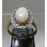 18ct opal and diamond ring. Ring size M&1/2. Approx weight 4.5 grams. (B.P. 21% + VAT)