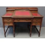 Edwardian oak writing desk, the gallery back with two fitted drawers, the central fall front leather