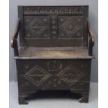 17th century carved oak plank chest with lozenge panels and original iron lock on bracket feet,