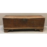 17th Century oak plank chest of plain rectangular form, the moulded top with hinged lid, the