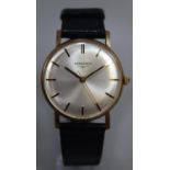 Longines 9ct gold gentleman's wristwatch with satin face and baton numerals on leather strap. 25g