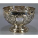 Early 20th Century silver centre bowl, overall with repousse floral and foliate decoration with