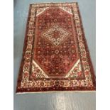 Fine woven full pile Persian Hosseinabad rug. 290x136cm approx. (B.P. 21% + VAT)