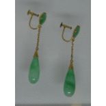 A pair of jade drop earrings set in 18ct gold with screw back fittings. Approx weight 5.4 grams. (