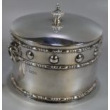 Silver Arts & Crafts design silver drum shaped two handled box and cover. The dome cover with fluted