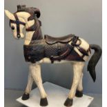 Large polychrome decorated carved wooden horse, possibly in Middle Eastern style, with moulded mane,