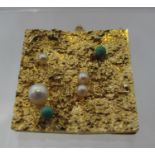 A modern 9ct textured gold brooch set with pearls and turquoise. Approx weight 8 grams. (B.P.