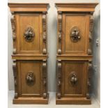 Pair of late Victorian mahogany cabinets, the moulded cornices above carved and moulded central
