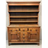 Early 19th Century North Wales oak two stage rack back dresser, the moulded and dental cornice above