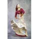 Royal Dux porcelain study of a Gypsy dancer with flowing floral dress on an oval base. Pink mark and
