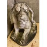Large weathered marble garden statue in the form of a stylised seated hound dog. 71cm long, 80cm