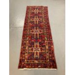 Persian hand woven runner with unique cross door design, on a multi coloured ground. 305x105cm