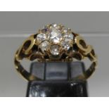 Diamond cluster ring with openwork shoulders. Ring size L&1/2. Approx weight 2.5 grams. (B.P.