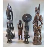 A group of carved wooden ethnic figures, African, Balinese etc. 21cm high up to 52cm high approx. (