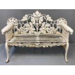 Good Victorian Coalbrookdale style cast iron garden bench, the shaped back with pierced oak and