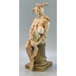 Late 19th century Doulton Burslem figure, 'Jester' resting on a plinth. signed by Noke 25cm