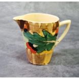 Clarice Cliff Lynton jug, in the holly leaves pattern. Unsigned, circa 1930's. 7.5cm high approx. (