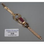 14ct gold ladies 'Secret' stone set bracelet watch, the cover set with rubies and diamonds,