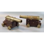 Pair of well made miniature brass and mahogany models of 18th century ships cannon, with stepped