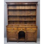 19th Century oak two stage rack back dog kennel dresser, the moulded cornice above boarded rack with