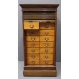 Early 20th Century oak tambour straight front filing cabinet, the interior revealing a bank of