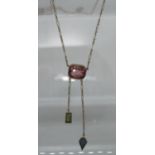 Art Deco Pink stone pendant with green tourmaline and sapphire drops. Approx weight 4.3 grams. (B.P.