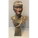 African hollow ceramic bust of a beaded chieftain, with metal armature on loaded base. 87cm high
