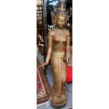 Polychrome painted Thai style carved wooden figure of a semi-nude dancer, standing on a circular