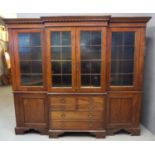 Mahogany two stage break front bookcase, the moulded cornice above four glazed doors, the interior