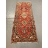 Persian Hamadan red wash ground runner with multicoloured stylised flowers and foliage. 290x100cm