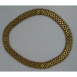 A gold collarette with integral clasp. Length 17 inches (43cm) Approx weight 52.5 grams. (B.P.