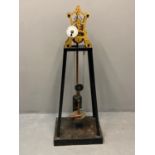 An unusual, thought to be a prototype, skeleton clock with engine turned brass frame, enamelled