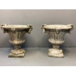 Pair of 19th century style composition Campana urn shaped planters, having moulded mask head and