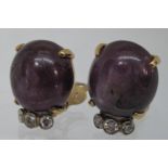 A pair of large synthetic star ruby and diamond earrings set in 14ct gold. Clip fittings. Approx