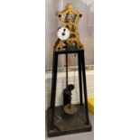 An unusual, thought to be a prototype, skeleton clock with engine turned brass frame, enamelled
